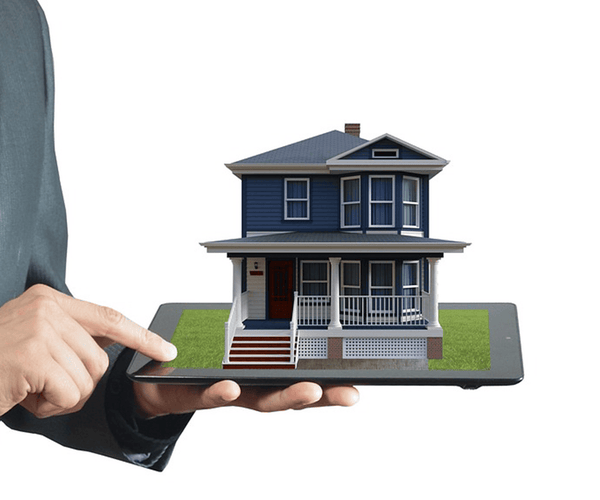 person holding a tablet with a house on it